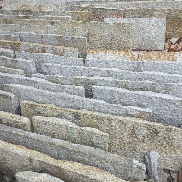 Feature image for Granite - Antiqued Plank - Pavers. The dominant color shown is gray; with brown, orange/rust, white and tan secondaries. Exhibits 