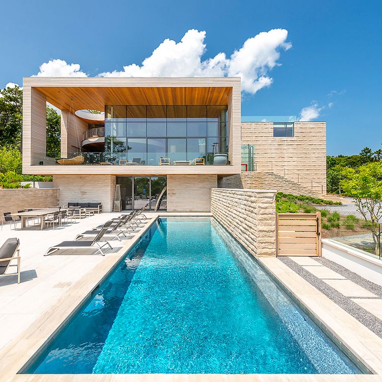 Feature image for Silver Shadow Limestone - Pool Coping. The image shows this product being used for pool coping and pool deck pavers. Dominant colors shown are white and cream; with beige and gray secondaries. Exhibits 