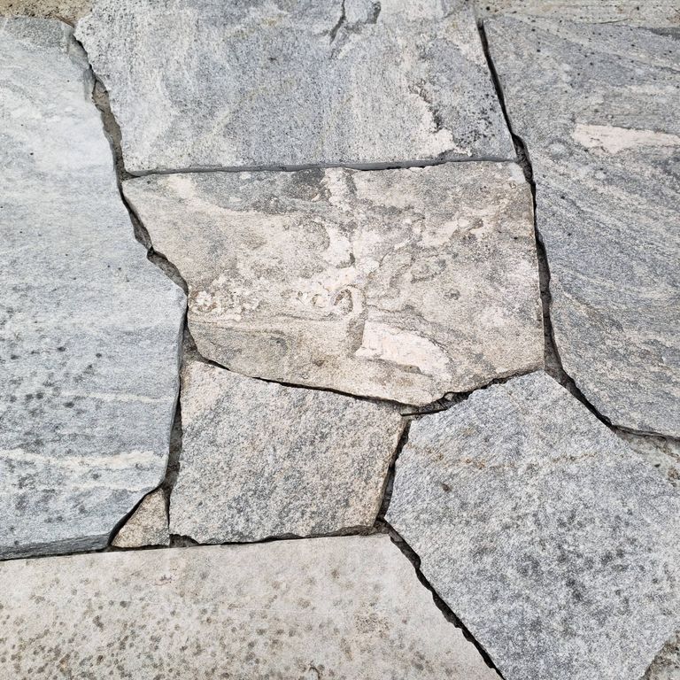 Close-up image for Liberty Hill Granite - Pavers. The surface finish shown is natural. The dominant color shown is gray; with beige, pink, white and cream secondaries. Exhibits 