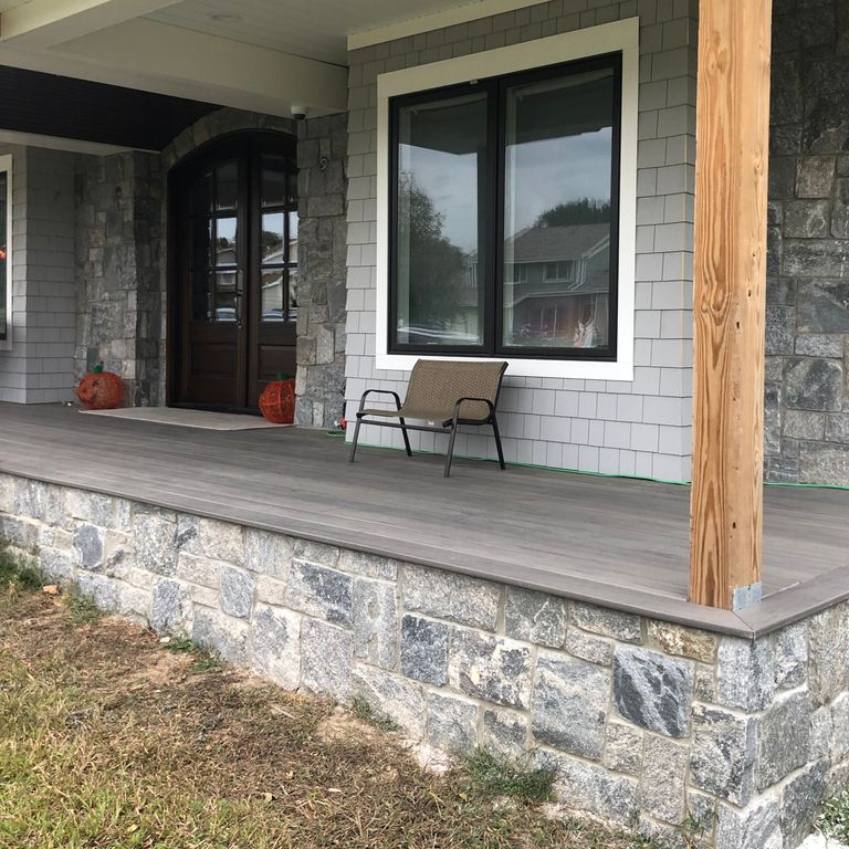Feature image for Granite - Liberty Hill - Veneer. The image shows this product being used in a thin veneer application. The dominant color shown is gray; with beige, pink, white, tan and cream secondaries. Exhibits 