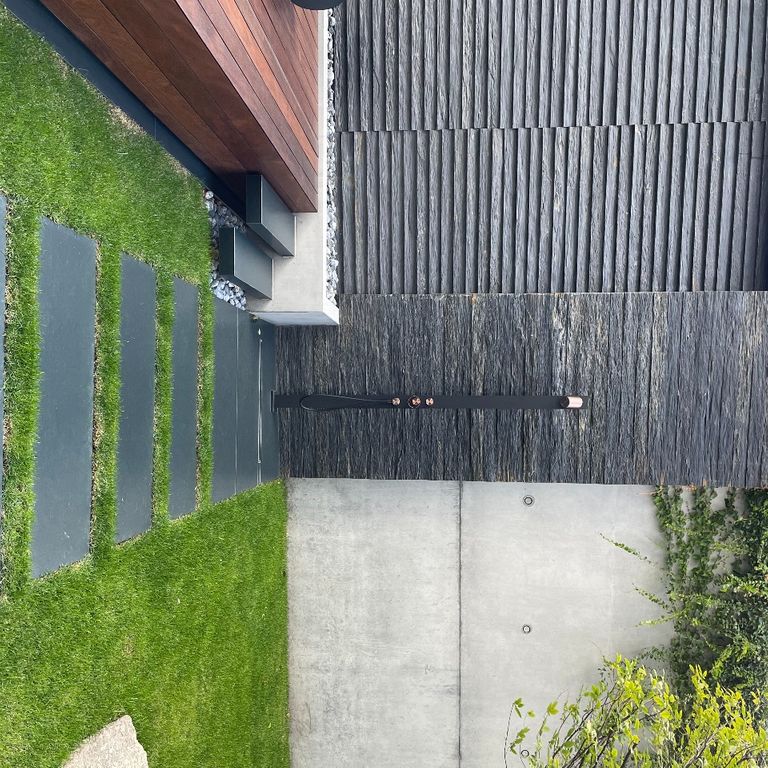 Application image for Black Schist - Wall Veneer. The image shows this product being used for full bed veneer and thin veneer. The surface finish shown is natural cleft. Dominant colors shown are black and gray. The color mix creates a cool feeling.