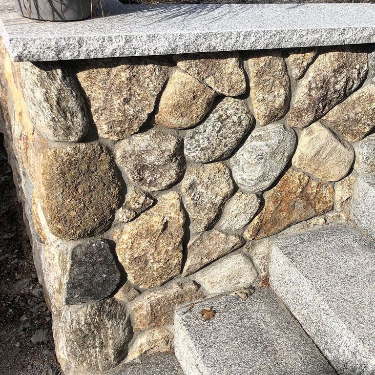 Application image for Fieldstone - Old New England Rounds - Thin Veneer. The image shows this product being used in a thin veneer application. The surface finish shown is natural. Dominant colors shown are brown, gray and tan. The color mix creates a warm feeling. Speckled and blotched color patterns.