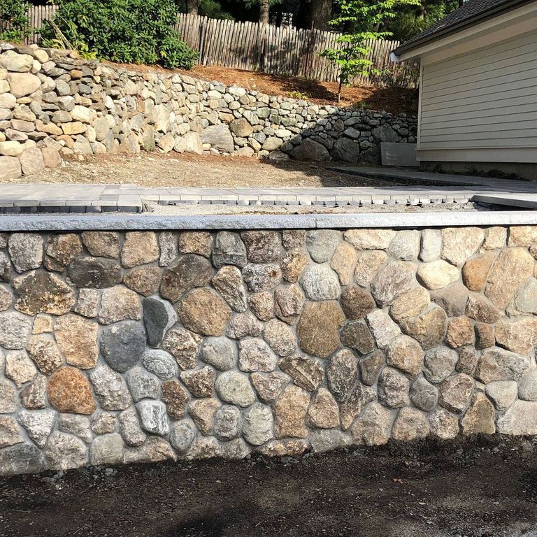 Application image for Fieldstone - Old New England Rounds - Thin Veneer. The image shows this product being used in a thin veneer application. The surface finish shown is natural. Dominant colors shown are beige, gray, tan and cream. The color mix creates a warm feeling. Speckled and blotched color patterns.