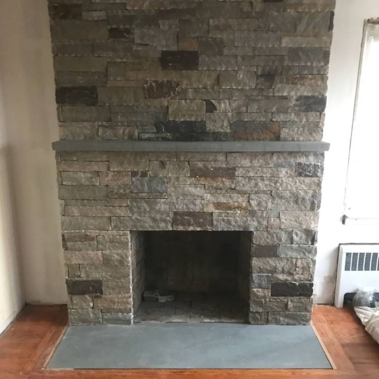 Application image for Granite - Colonial Tan - Veneer. The image shows this product being used for fireplace surround, thin veneer and interior cladding.