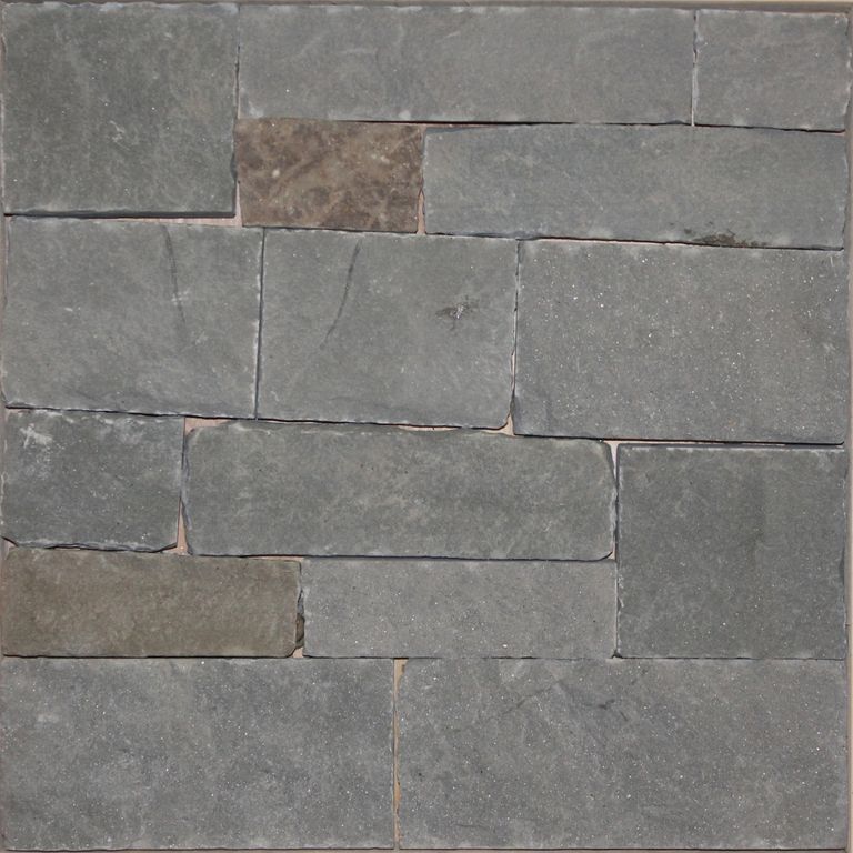 Close-up image for Colonial Wall Granite - Veneer. The surface finish shown is split-face with flat plane. The dominant color shown is gray; with brown, green and purple secondaries. Regular and cloudy color patterns.