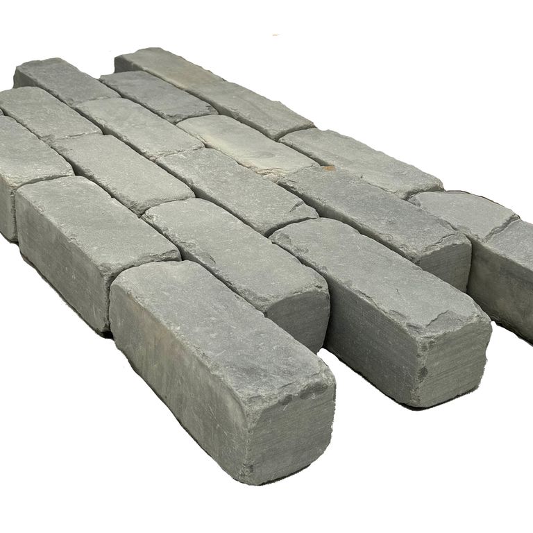 Application image for Blue/Gray Bluestone - Cobblestone Pavers. The surface finish shown is tumbled. The dominant color shown is gray.