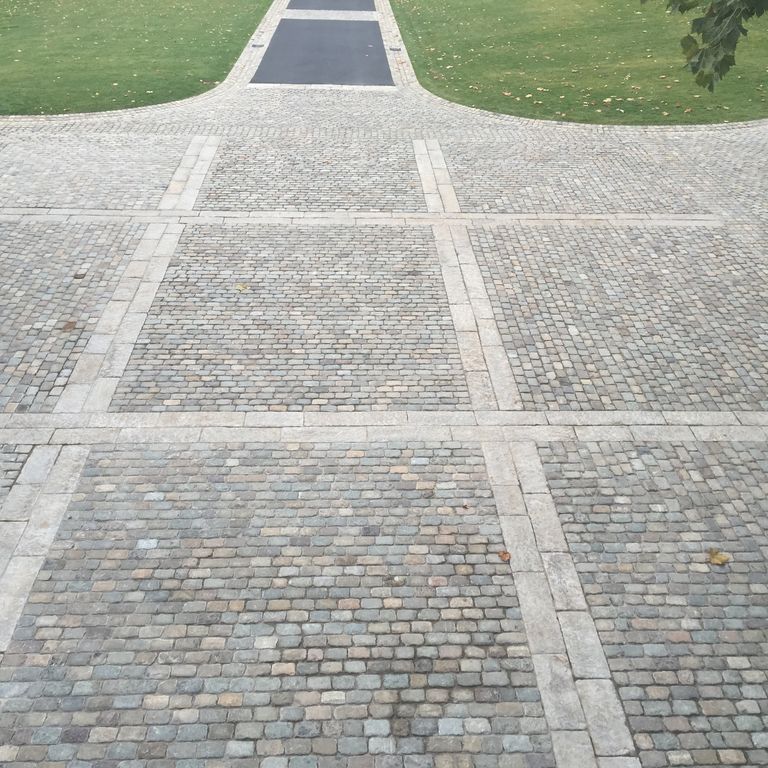 The image shows this product being used in a driveway pavers application.