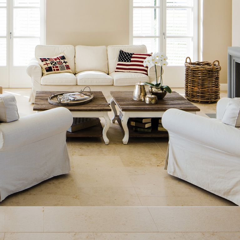 Feature image for Bavarian Limestone - Beige - Interior Floor. The image shows this product being used in an interior floor application. Dominant colors shown are beige and tan; with brown, orange/rust, white and cream secondaries. Exhibits 