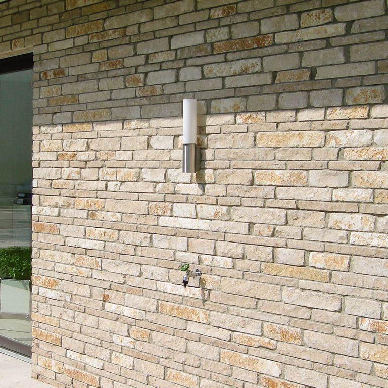 Application image for Bavarian Beige Limestone - Veneer. The image shows this product being used for full bed veneer and thin veneer. The surface finish shown is split-face. Dominant colors shown are beige and tan. The color mix creates a warm feeling.