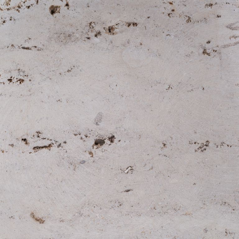 Color/Finish variation image for Bavarian Travertine - Beige - Wall Veneer. The surface finish shown is honed. The dominant color shown is gray; with beige, blue, brown, pink, purple and white secondaries. Exhibits 