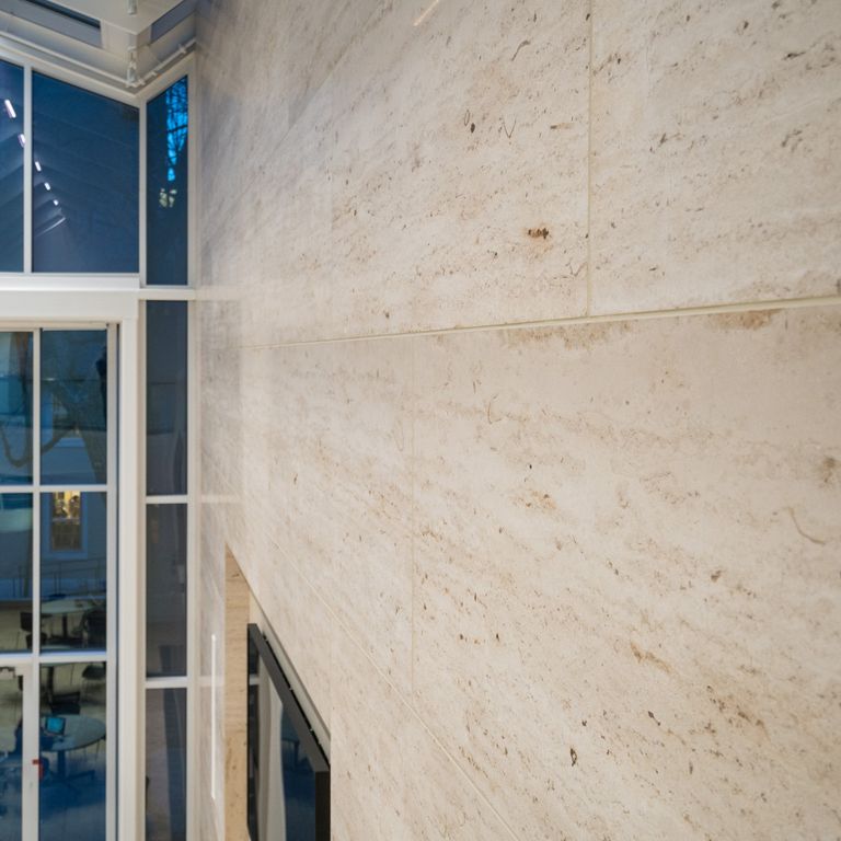 Application image for Travertine - Bavarian Beige - Veneer. The image shows this product being used for full bed veneer, thin veneer and interior cladding.