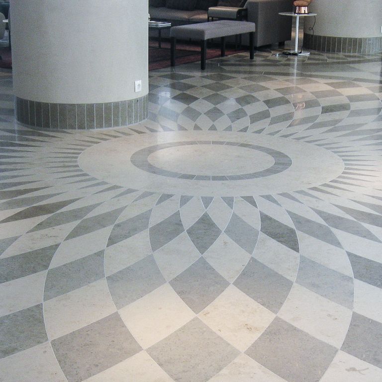 Application image for Limestone- Bavarian Gray - Interior Floor. The image shows this product being used in an interior floor application. The dominant color shown is gray. The color mix creates a cool feeling.