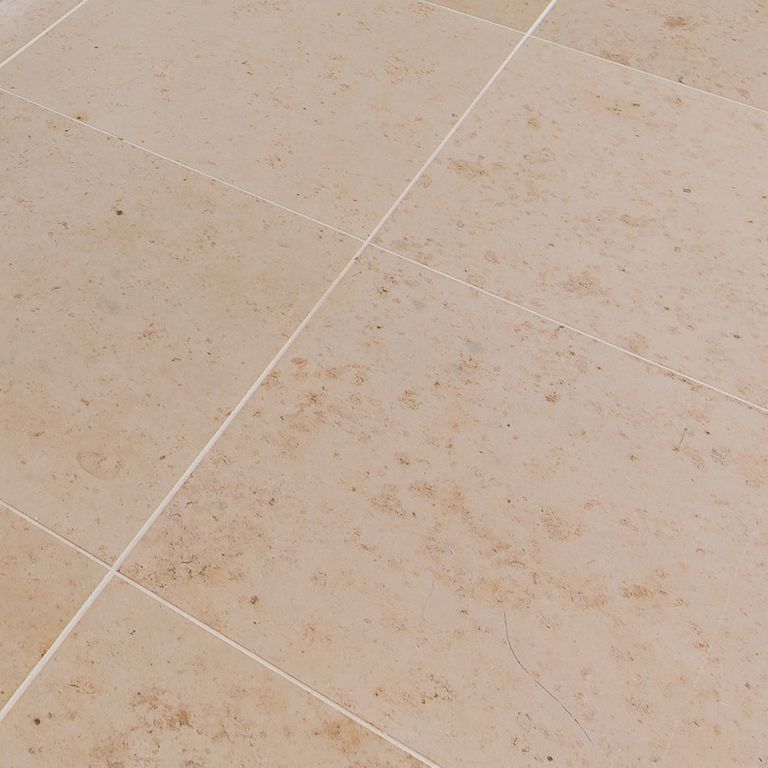Close-up image for Bavarian Limestone Gala - Beige - Interior Floor. The surface finish shown is honed. Dominant colors shown are beige and tan; with a brown secondary. Exhibits 
