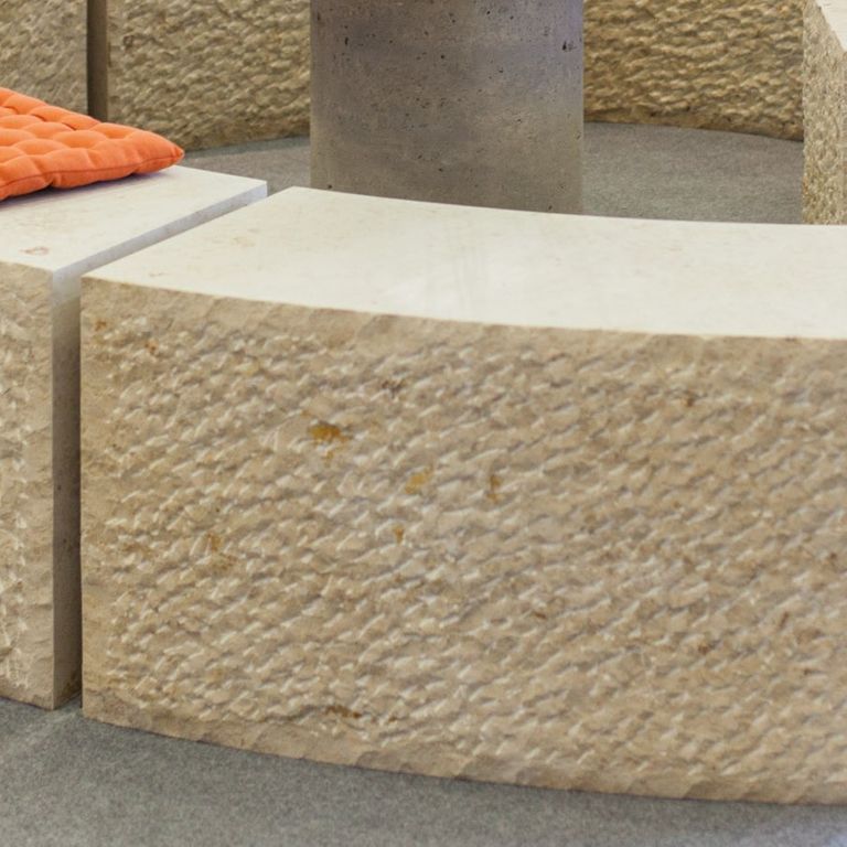 Close-up image for Bavarian Limestone Gala - Beige - Benches & Seating. The surface finish shown is chiseled. Dominant colors shown are beige, brown and tan; with a cream secondary. The color mix creates a warm feeling. Regular and speckled color patterns. Contains mineral inclusions.