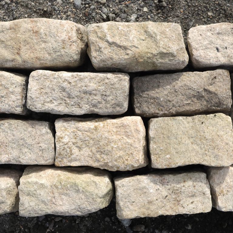 Feature image for Granite - Cobblestones - Phoenician Buff. Dominant colors shown are beige, tan and cream; with a brown secondary. The color mix creates a warm feeling. Speckled color pattern. Contains some mica.