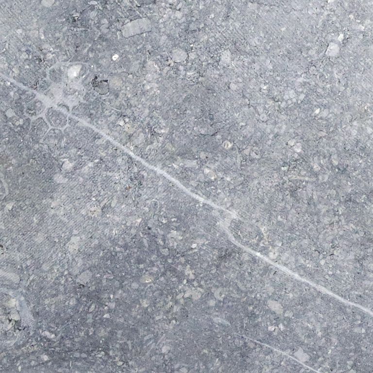 Swatch image cropped for Reclaimed Belgian Bluestone Cobblestones - Flat Surface. The surface finish shown is sawn. Dominant colors shown are blue and gray; with a white secondary. Exhibits 