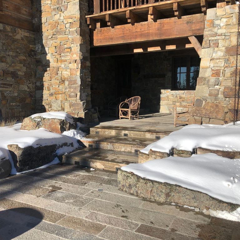 Application image for Granite- Reclaimed Footworn- Steps - Treads. The image shows this product being used in a treads application. Dominant colors shown are black, brown, gray and tan. The color mix creates a warm feeling.