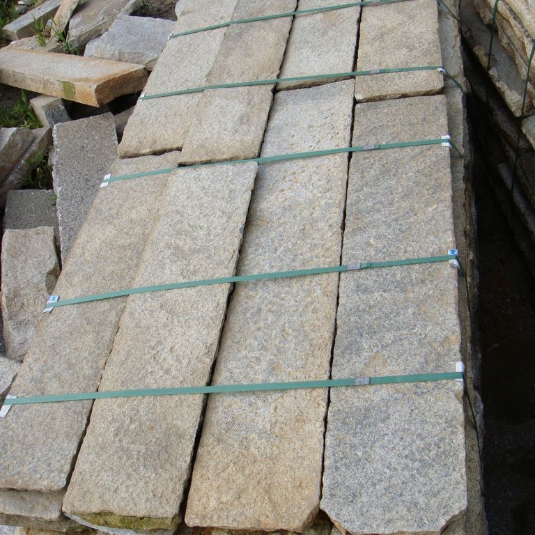 Application image for Granite- Reclaimed Footworn- Steps - Treads. Dominant colors shown are beige, brown, gray and tan.