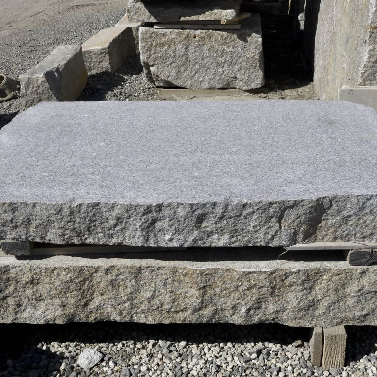 Application image for Granite - Reclaimed Landings - Sawn and Flamed Top, Live Edge. The surface finish shown is flamed. The dominant color shown is gray; with a white secondary. The color mix creates a cool feeling.