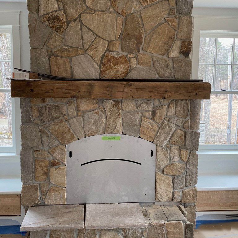 Feature image for Quartzite - Sterling Tan - Veneer. The image shows this product being used for fireplace surround, full bed veneer, thin veneer and interior cladding. The surface finish shown is split-face. Dominant colors shown are beige, brown, gray and tan. Exhibits 