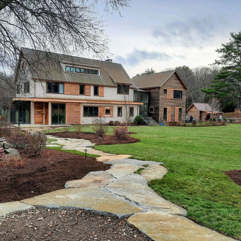 Application image for Dodlin Hill Granite - Irregular Pavers. The image shows this product being used in a path pavers application. The surface finish shown is natural cleft. Dominant colors shown are brown and gray. The color mix creates a warm feeling.