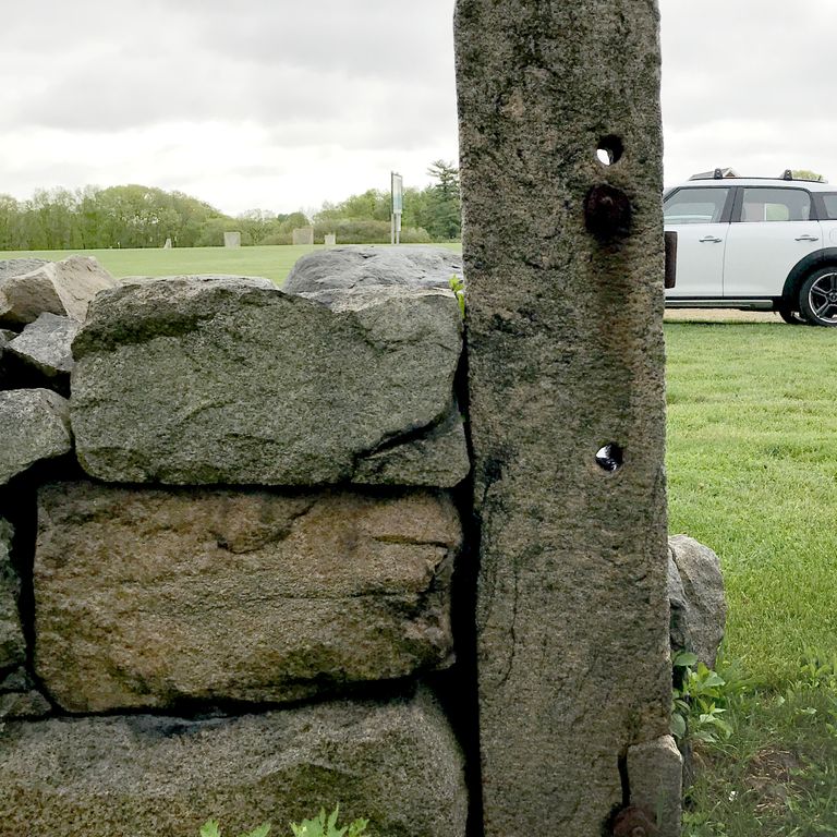 Application image for Reclaimed First Generation Curbstone - Posts. The image shows this product being used in a posts application. The dominant color shown is gray.