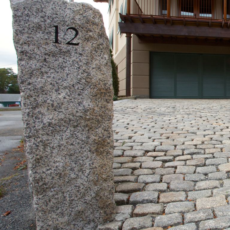 Application image for Reclaimed First Generation Curbstone - Posts. The image shows this product being used in a posts application. The dominant color shown is gray.