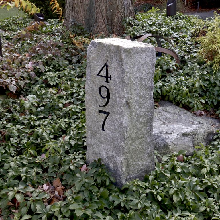 Application image for Reclaimed First Generation Curbstone - Posts. The image shows this product being used in a posts application. The dominant color shown is gray.