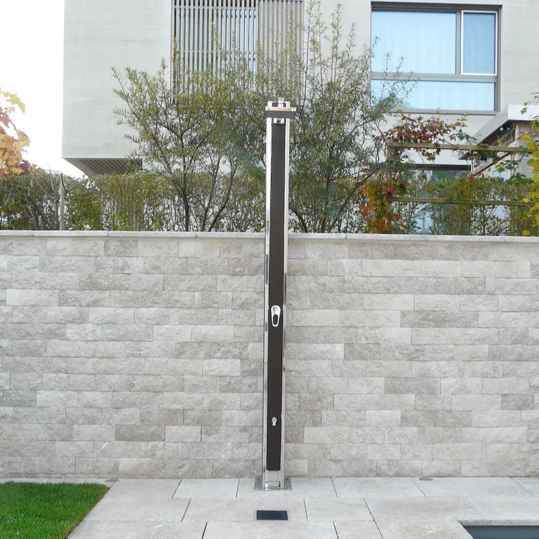 Feature image for Dalmatian Limestone Veneer. The image shows this product being used in a thin veneer application. The surface finish shown is split-face with flat plane. Dominant colors shown are beige, gray and white; with a pink secondary. The color mix creates a cool feeling. Regular color pattern.