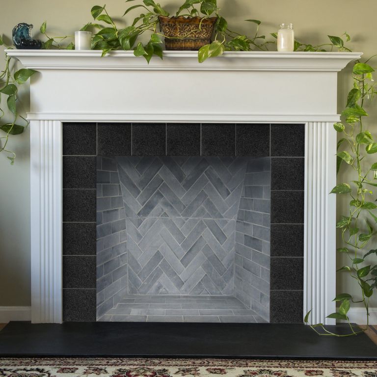 Feature image for Curators Soapstone Firebrick. The image shows this product being used in a firebrick application. The surface finish shown is honed. Dominant colors shown are blue and gray. The color mix creates a cool feeling. Regular color pattern.