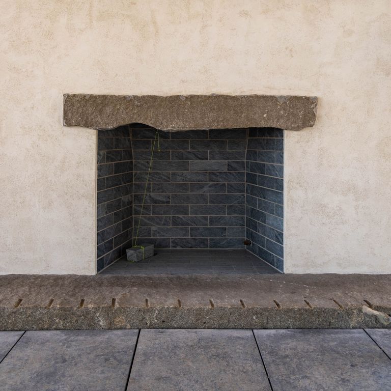 Application image for Stone Curators Soapstone Firebricks. The image shows this product being used in a firebrick application. The dominant color shown is gray. The color mix creates a cool feeling.