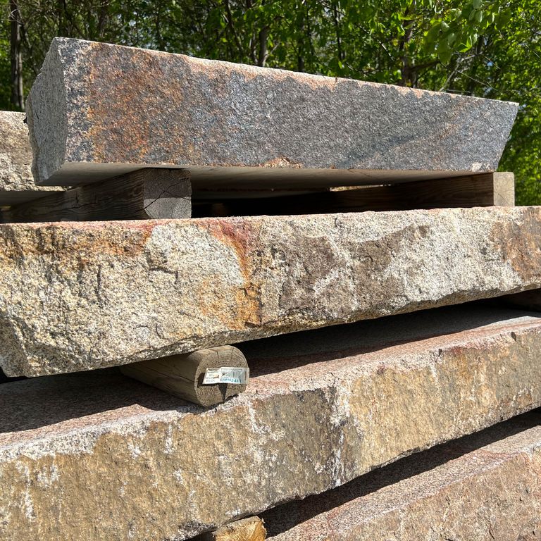 Application image for Granite - Cape Neddick Full Color - Live Edge Steps - Flamed Tops. The surface finish shown is a combination of flamed and natural. Dominant colors shown are beige and tan; with black, brown, gray, orange/rust, white and cream secondaries. The color mix creates a warm feeling. Blotched color pattern.