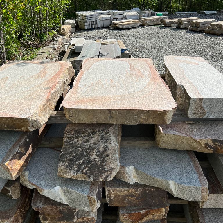 Application image for Granite - Cape Neddick Full Color - Live Edge Steps - Flamed Tops. The surface finish shown is a combination of flamed and natural. Dominant colors shown are beige and cream; with brown, gray, orange/rust, pink, white and tan secondaries. Exhibits 