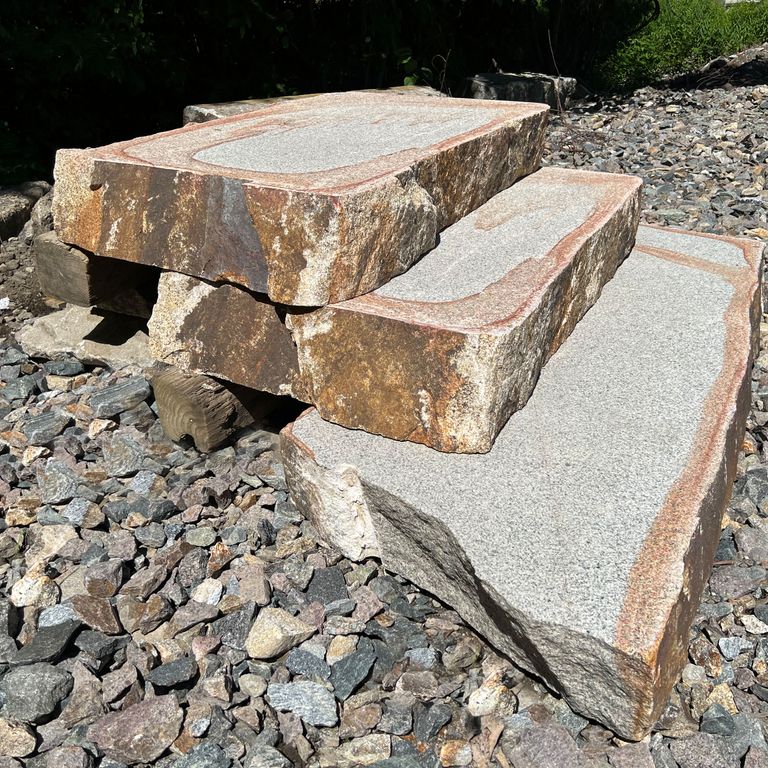 Application image for Granite - Cape Neddick Full Color - Live Edge Steps - Flamed Tops. The surface finish shown is a combination of flamed and natural. The dominant color shown is gray; with beige, brown, orange/rust, pink, white, tan and cream secondaries. The color mix creates a warm feeling. Streaked, speckled and blotched color patterns.