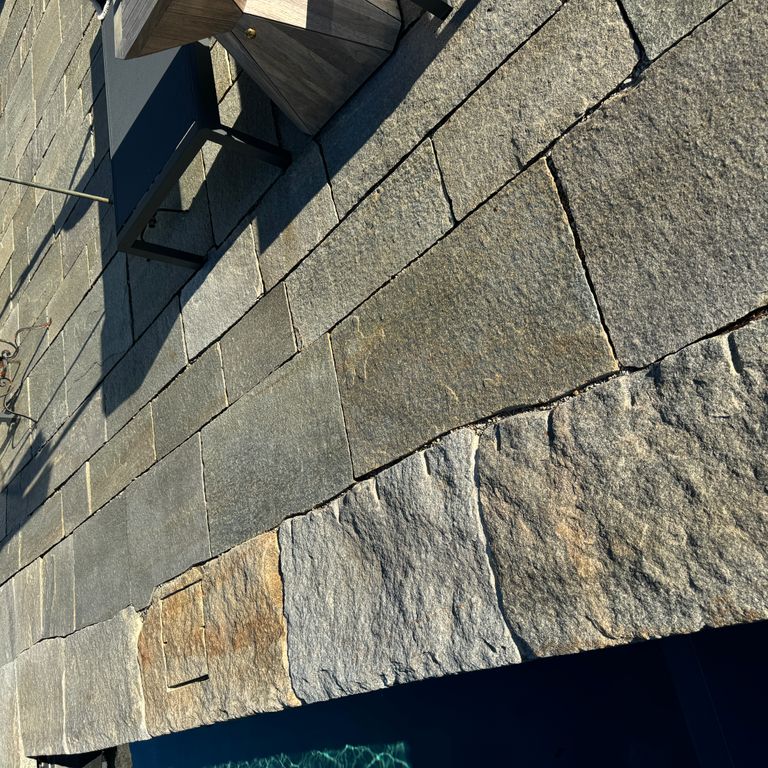 Application image for Pietra Italia Full Color Gneiss - Pavers. The image shows this product being used in a pool deck pavers application. The surface finish shown is natural cleft. Dominant colors shown are beige and gray. The color mix creates a warm feeling.