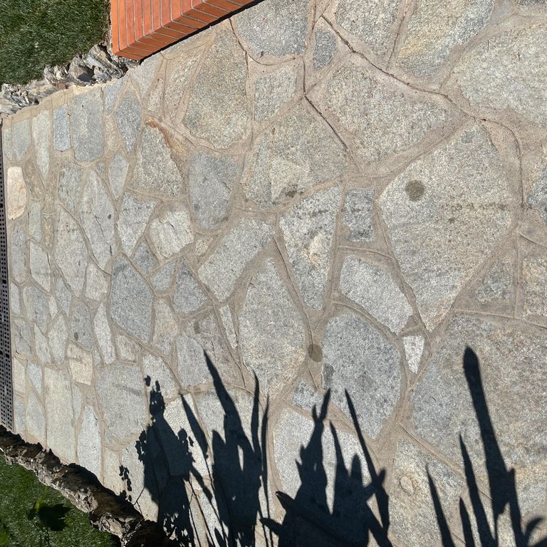 Application image for Pietra Italia Full Color Gneiss - Irregular Pavers. The image shows this product being used in a path pavers application. The surface finish shown is natural cleft. Dominant colors shown are beige and gray. The color mix creates a warm feeling.