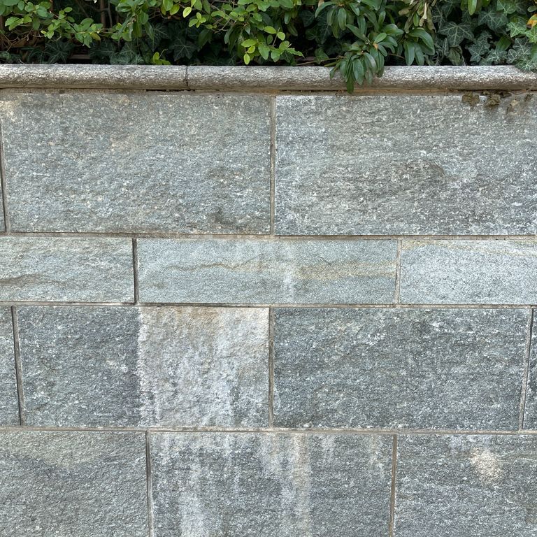 Application image for Pietra Italia Full Color Gneiss - Veneer. The image shows this product being used in a thin veneer application. The surface finish shown is . Dominant colors shown are beige and gray. The color mix creates a warm feeling. Regular and fine speckled color patterns.