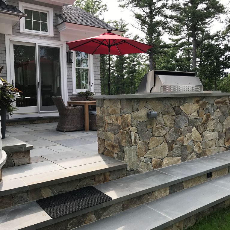 Application image for Black Mountain Granite Natural - Veneer. The image shows this product being used in a thin veneer application. Dominant colors shown are black and gray. The color mix creates a warm feeling.