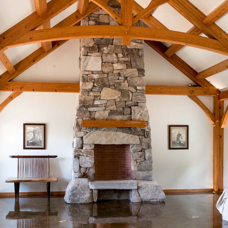 Application image for Black Mountian Granite - Natural Veneer. The image shows this product being used for fireplace surround, thin veneer and interior cladding. The surface finish shown is natural cleft. The dominant color shown is brown. The color mix creates a warm feeling.
