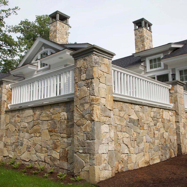 Application image for Black Mountain Granite Natural - Veneer. The image shows this product being used in a thin veneer application. The surface finish shown is natural cleft. Dominant colors shown are brown and gray. The color mix creates a warm feeling.