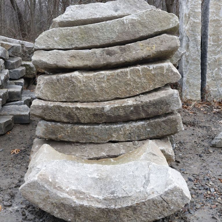Best close-up image for Reclaimed Granite Curbstone - Radius Curve. The surface finish shown is . The dominant color shown is gray. The color mix creates a warm feeling. Regular color pattern.