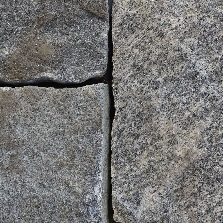 Feature image for Chester Granite - Veneer - Bed/Seam Splitface. The image shows this product being used in a thin veneer application. The surface finish shown is . The dominant color shown is gray. The color mix creates a cool feeling. Regular and random color patterns.