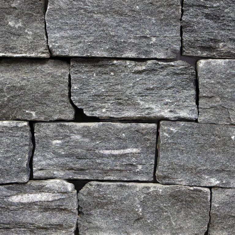 Feature image for Raven Hill Granite - Veneer - End Grain Split. The surface finish shown is split-face. The dominant color shown is gray. Exhibits 