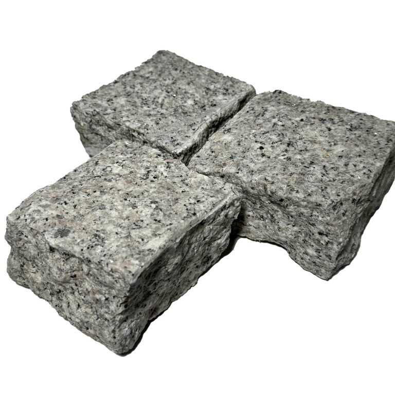 Feature image for Salt & Pepper Granite - Splitface Cobblestones. The surface finish shown is split-face. The dominant color shown is gray. The color mix creates a cool feeling.