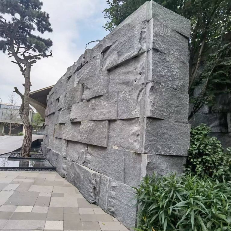 Application image for Granite - Zen Gray - Quarry Skin Thin Veneer. The image shows this product being used in a thin veneer application. The surface finish shown is natural cleft. The dominant color shown is gray. The color mix creates a cool feeling.