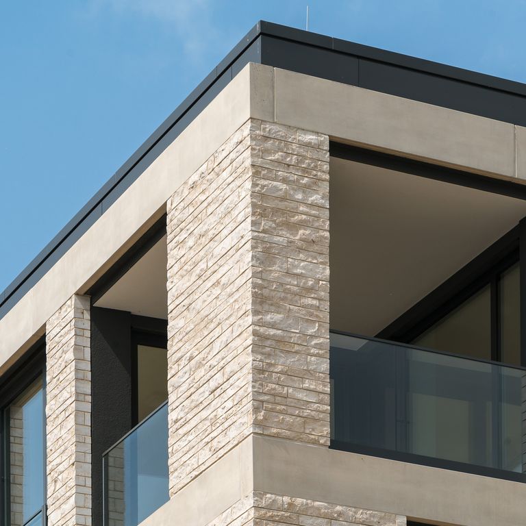 Application image for Limestone - Bavarian Beige - Bavarian Brick. The image shows this product being used in a thin veneer application. The surface finish shown is split-face. Dominant colors shown are beige and tan. The color mix creates a warm feeling.