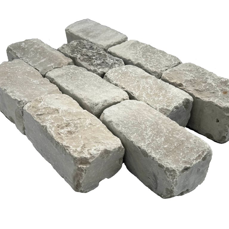 Feature image for Limestone - Madison - Cobblestone (Sawn Sides, Split Top/Bottom). The image shows this product being used for driveway pavers, path pavers, patio pavers and driveway aprons. The surface finish shown is . The dominant color shown is gray.