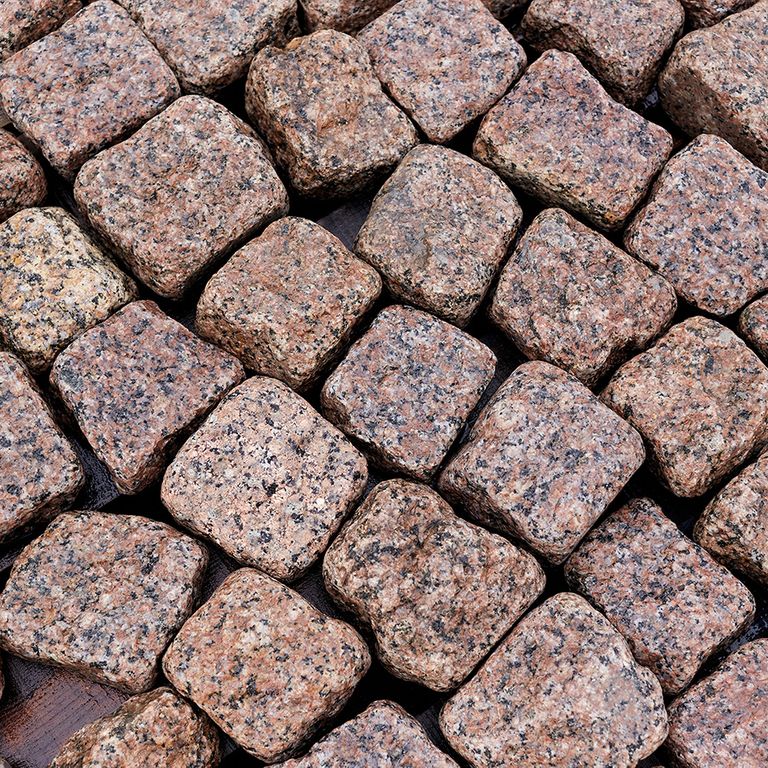 Application image for Red Pomegranate Granite - Cobblestones. The surface finish shown is tumbled. The dominant color shown is red. The color mix creates a warm feeling.