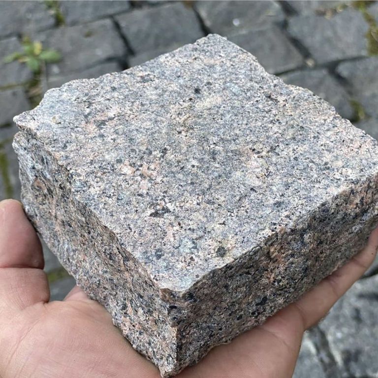 Best close-up image for Granite - Brown Coffee - Cobblestone. The dominant color shown is brown. The color mix creates a warm feeling.