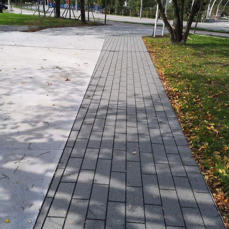Application image for Gabbro - Dark Magma - Pavers. The image shows this product being used in a patio pavers application. The dominant color shown is gray. The color mix creates a warm feeling.